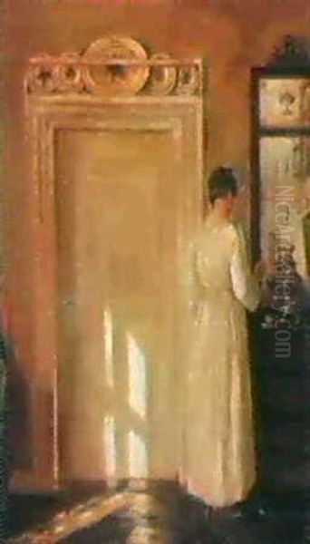 Interior Med En Dame Der Ordner Tingene Pa En Kommode Oil Painting by Carl Vilhelm Holsoe