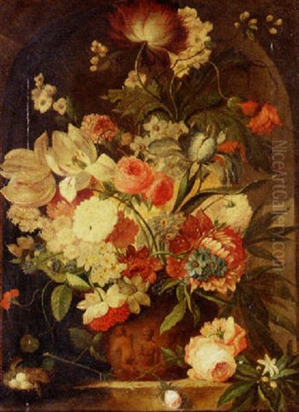 A Flower Still Life With A Bird's Nest On A Marble Ledge by Jan Van Huysum