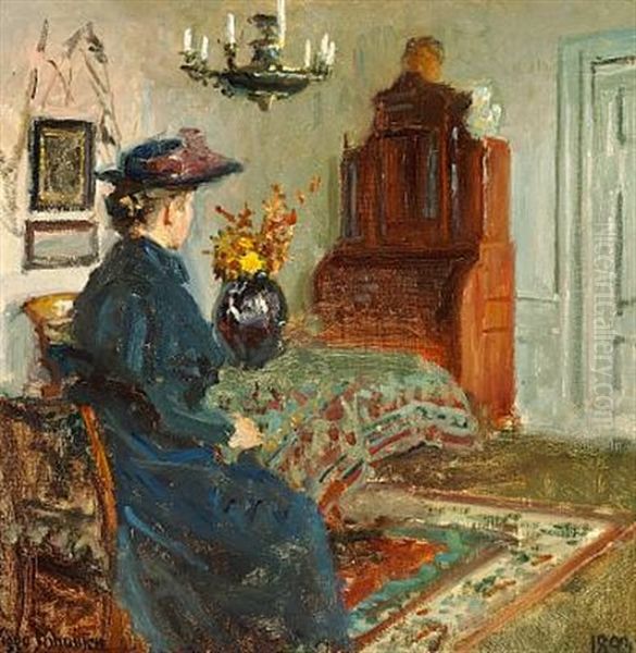 Interior With The Artist's Wife Martha In A Coat And Hat, Seated Oil Painting by Viggo Johansen