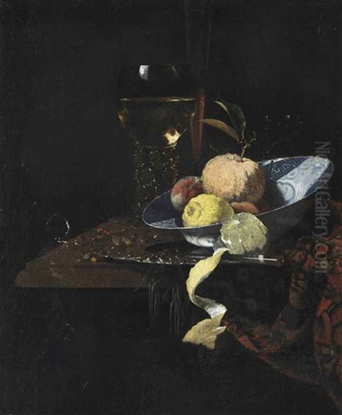 A Roemer, A Glass Flute, An Orange, Two Peaches And A Lemon In A Blue And White Wanli Kraak Charger With A Knife And A Partially Peeled Lemon... Oil Painting by Willem Kalf