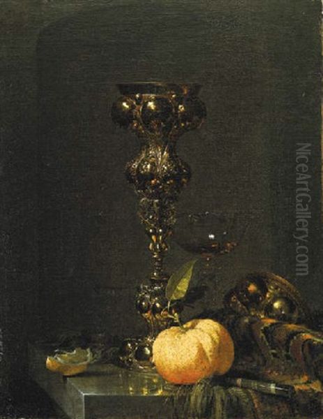 A Steeple Cup With Upturned Cover, A Glass Of Wine, An Orange And A Knife On An Oriental Rug On A Draped Marble Ledge Oil Painting by Willem Kalf