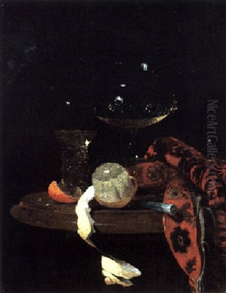 A Still Life Of A Wine Glass, A Roemer, A Partly Peeled Lemon, And A Knife On A Table, Partly Draped With A Carpet Oil Painting by Willem Kalf