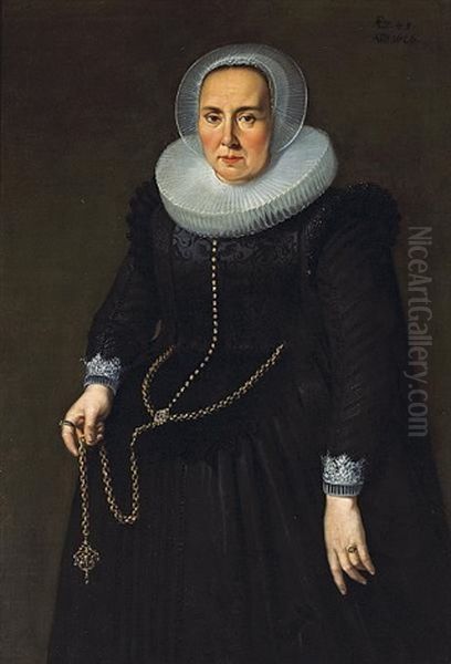 A Portrait Of A Lady, In A Black Dress With An Embroidered Bodice, Lace Cuffs And Collar, Holding A Large Gold Chain Oil Painting by Thomas De Keyser