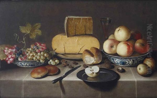 Cheese On A Silver Plate, Red And White Grapes And Apples In Porcelain Wanli Bowls, Bread Rolls, A Knife And A Sliced Apple On A Plate, All On A Draped Table Oil Painting by Roelof Koets