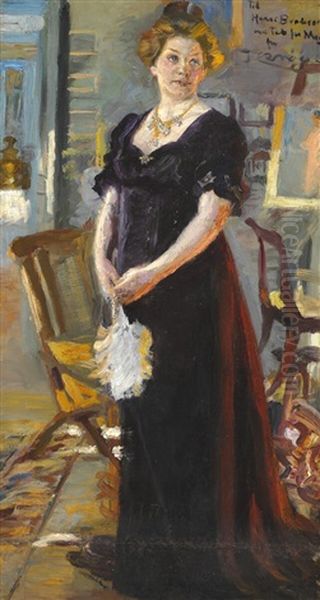 Mrs Henny Brodersen In A Purple Dress With A Fan Standing In Front Of The Fireplace Oil Painting by Peder Severin Kroyer