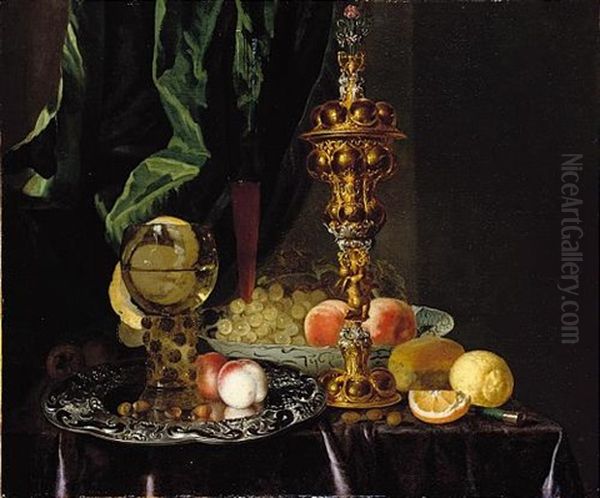 A Still Life Of Peaches, Grapes, A Lemon, A Segment Of Orange, Hazelnuts And A Bread Roll, Together With A Roemer, A Large Gold Pronckblokaal And A Silver Platter, All Laid Out On A Draped Table Oil Painting by Simon Luttichuys