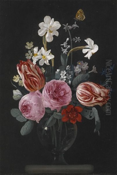 A Still Life Of Tulips, Roses, Daffodils And Other Flowers, With Butterflies, In A Glass Vase On A Stone Ledge Oil Painting by Christiaan Luycks