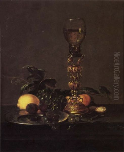 A Roemer Of White Wine On An Elaborate Stand With Black Grapes And Plums On A Pewter Plate, A Lemon, White Grapes, Peaches, Nuts And Berries Oil Painting by Cornelis Mahu