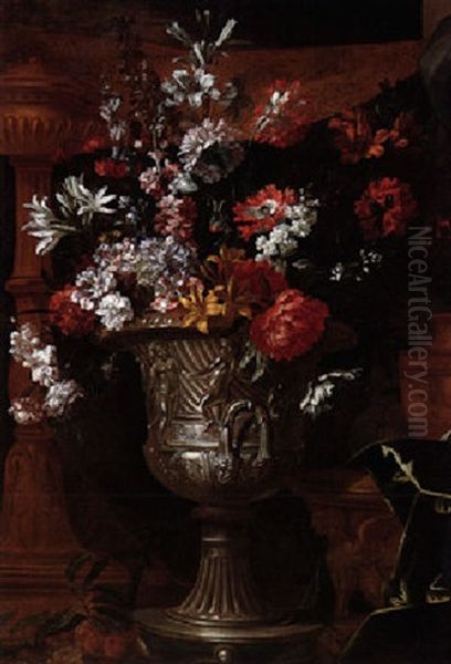 A Still Life Of Carnations, Lilies And Other Flowers In A Silver Gilt Urn, A Gilt Torchere And A Draped Embroidered Curtain Behind Oil Painting by Antoine Monnoyer