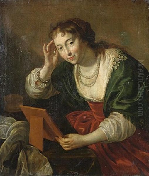 A Young Woman Looking In A Mirror Oil Painting by Paulus Moreelse