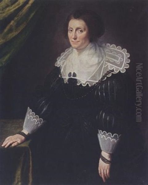 A Portrait Of A Lady Wearing A Black Dress With A Composite White Collar And Cuffs, A Black Headdress And Pearl Jewellery Oil Painting by Paulus Moreelse