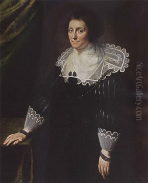 A Portrait Of A Lady, Wearing A Black Dress With A Composite White Collar And Cuffs, A Black Headdress And Pearl Jewellry Oil Painting by Paulus Moreelse