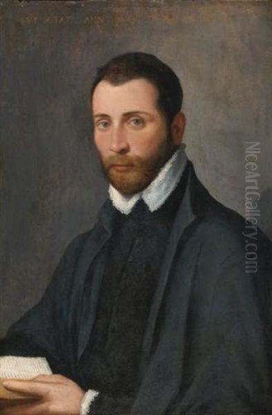 Portrait Of A Young Man, Half Length, Holding A Book Oil Painting by Giovanni Battista Moroni