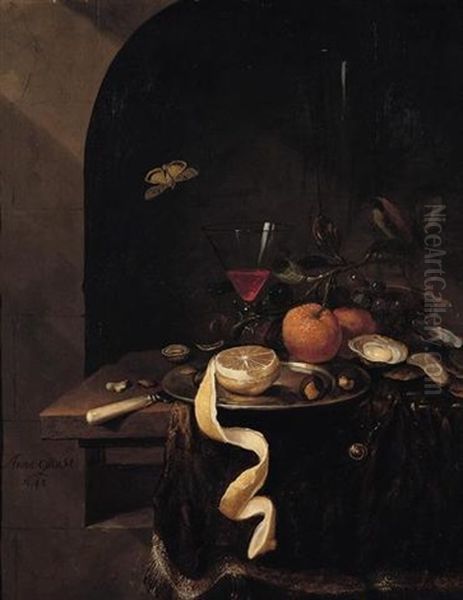 Still Life Of A Wine Glass With Oranges, Grapes, Oysters, Nuts And A Peeled Lemon Upon A Pewter Plate, Arranged On A Ledge Draped With A Brown Cloth Within A Stone Niche Oil Painting by Jan Mortel