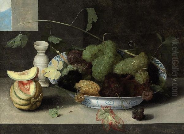 A Kraak Porcelain Bowl Of Grapes, With A Cut Melon And A Stonewarevase On A Stone Ledge Oil Painting by Peter Paul Binoit