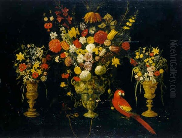 Tulips, Carnations, Irises, Daffodils, Hyacinths And Other Flowers In Three Silver-gilt Standing Cups With Parrot And Squirrel Oil Painting by Astolfo Petrazzi