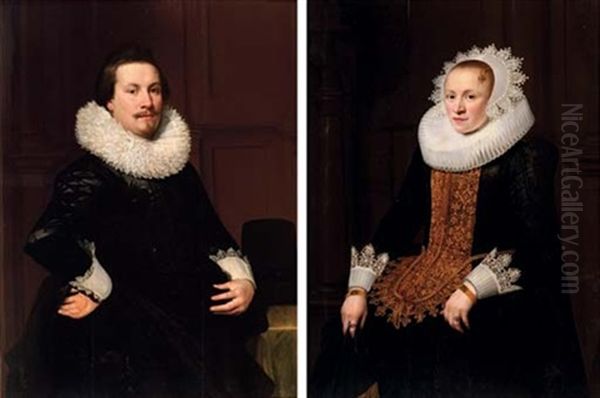 Portrait Of A Gentleman In A Black Coat And Lace Collar (+ Portrait Of A Lady In A Black Dress With Gold Trim And A Lace Collar And Headdress; Pair) Oil Painting by Jan Anthonisz Van Ravesteyn