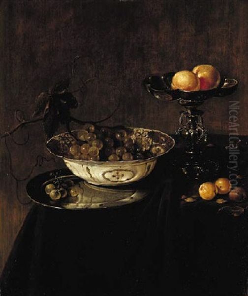 Grapes In A Delftware Bowl On A Silver Plate, Peaches On A Tazza, And Plums On A Draped Table Oil Painting by Jan Jansz. Treck