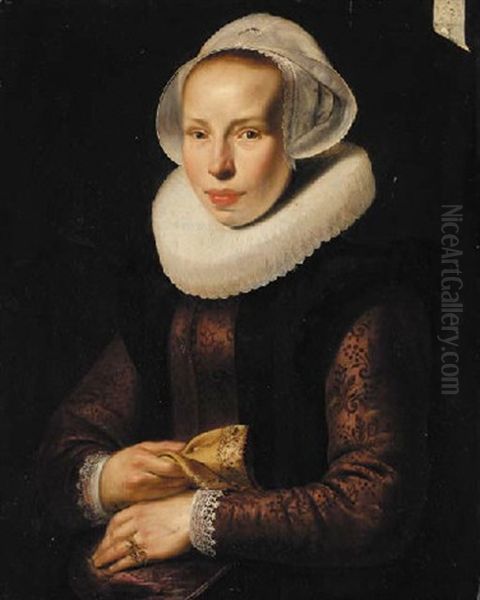 Portrait Of A Lady In An Embroidered Burgundy Bodice, With A White Ruff And White Cap, A Glove In Her Right Hand Oil Painting by Werner van den Valckert