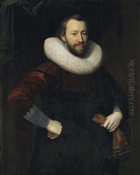 Portrait Of A Gentleman, Three-quarter-length, In A Red And Black Costume With A Lace Collar, Holding A Pair Of Gloves In His Left Hand Oil Painting by Cornelis van der Voort