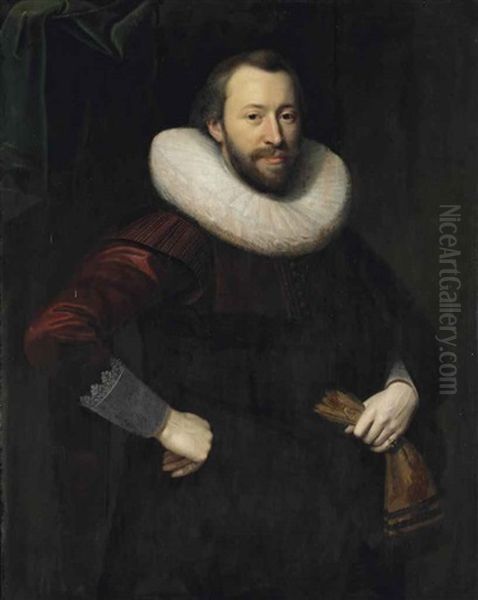 Portrait Of A Gentleman, Three-quarter-length, In A Red And Black Costume With A Lace Collar, Holding A Pair Of Gloves In His Left Hand Oil Painting by Cornelis van der Voort