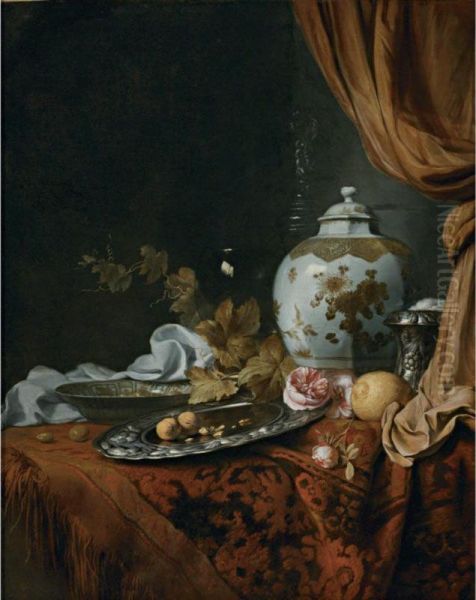 A Blue And White Facetted Vase, A Rose And Walnuts On A Pewter Plate, A Wanli 'kraak' Porcelain Bowl, A Silver Wine Cooler, A Wineglass, A Glass, A Lemon And Roses On A Table Draped With A Carpet Oil Painting by Joseph de Bray