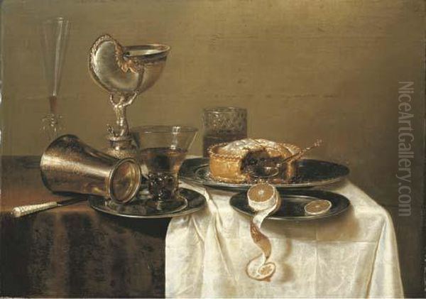 An Overturned Silver Tumbler And A Roemer On A Pewter Plate, A Facon-de-venise Wineglass, A Nautilus Cup, A Pie And A Partly-peeled Lemon On Pewter Plates On A Partly-draped Table Oil Painting by Gerrit Willemsz. Heda