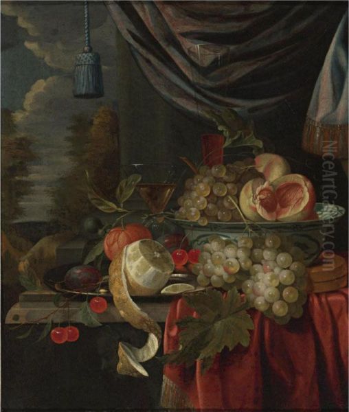 Still Life Of Grapes And Peaches In A Blue And White Porcelain Bowl, A Peeled Lemon, Plums And Cherries On A Pewter Plate, With Glasses And Other Fruit On A Draped Table, A Landscape Beyond Oil Painting by Gillis Jacobsz. Hulsdonck