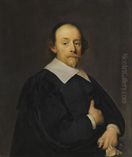 A Portrait Of A Man In Black, Half Length, Holding A Pair Of Gloves Oil Painting by Cornelius Janssens Van Ceulen