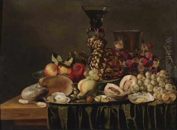 Still Life With A Gilt Cup And Glass Holder, A Silver Beaker, A Nautilus Shell, Fruit, And Oysters Arranged On A Draped Ledge. Oil Painting by Carstiaen Luyckx