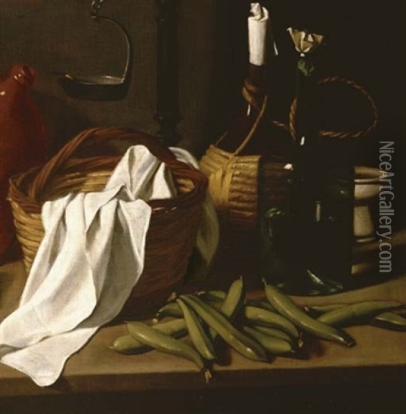 A Kitchen Still Life - A Candlestick, An Earthenware Jar, A Porcelain Soup Bowl, A Basket And Tablecloth, Two Bottles, Beans And Assorted Fruits On A Tabletop Oil Painting - Carlo Magini