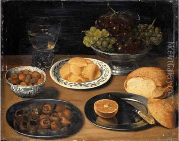 Grapes In A Pewter Bowl, A Roemer Of White Wine, Hazelnuts And Slices Of Butter In Porcelain Dishes, Chestnuts, A Sliced Lemon And A Knife On Pewter Platters, With A Bread Roll On A Wooden Ledge Oil Painting - Georg Flegel