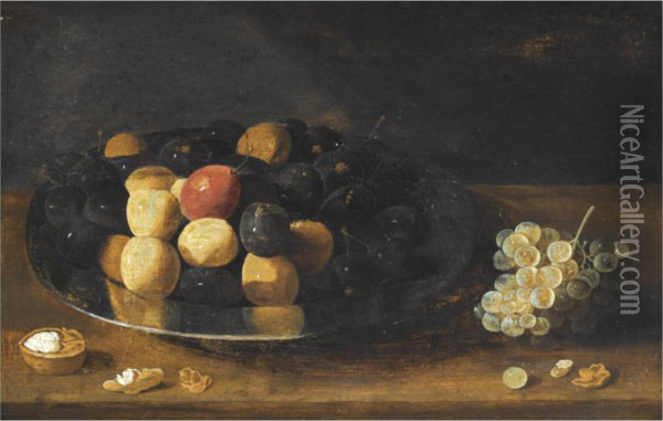 A Still Life With Plums On A Silver Tazza, Together With Grapes Anda Walnut, All On A Wooden Table Oil Painting - Gillis Jacobsz. Hulsdonck