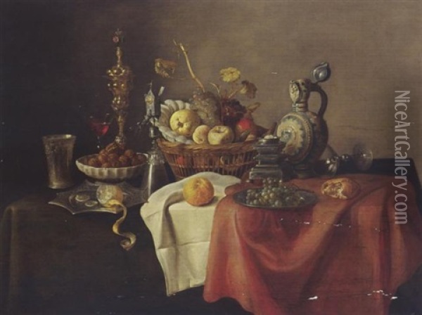 A Sumptuous Still Life With A Silver-giltbeaker, A Lemon, Walnuts, A Cup, A Glass, Fruit In A Basket, And Bread On A Draped Table Oil Painting - Cornelis Mahu